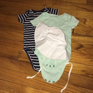 Short sleeve baby bodysuits and a baby hat